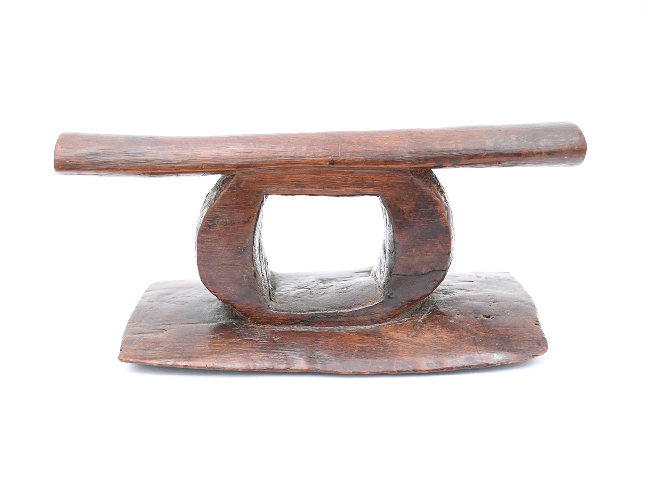 wooden headrest with oval shaped support