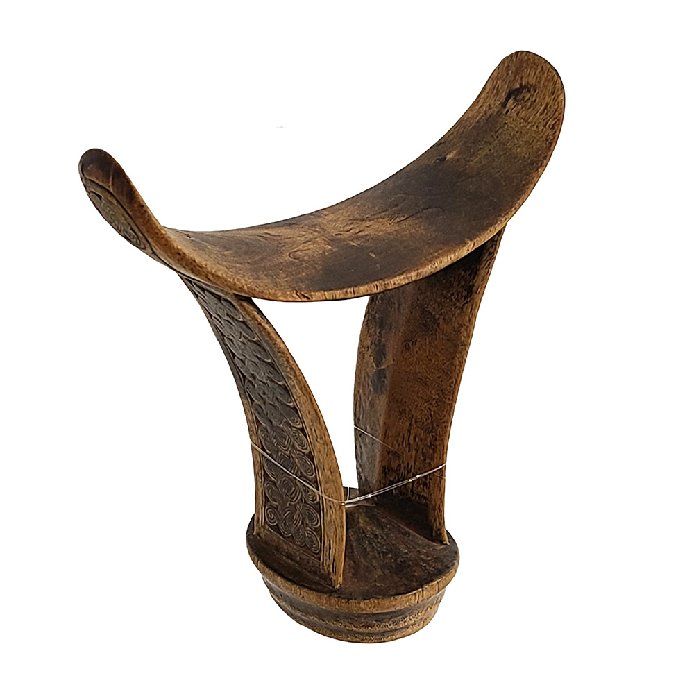 wooden headrest with uneven base