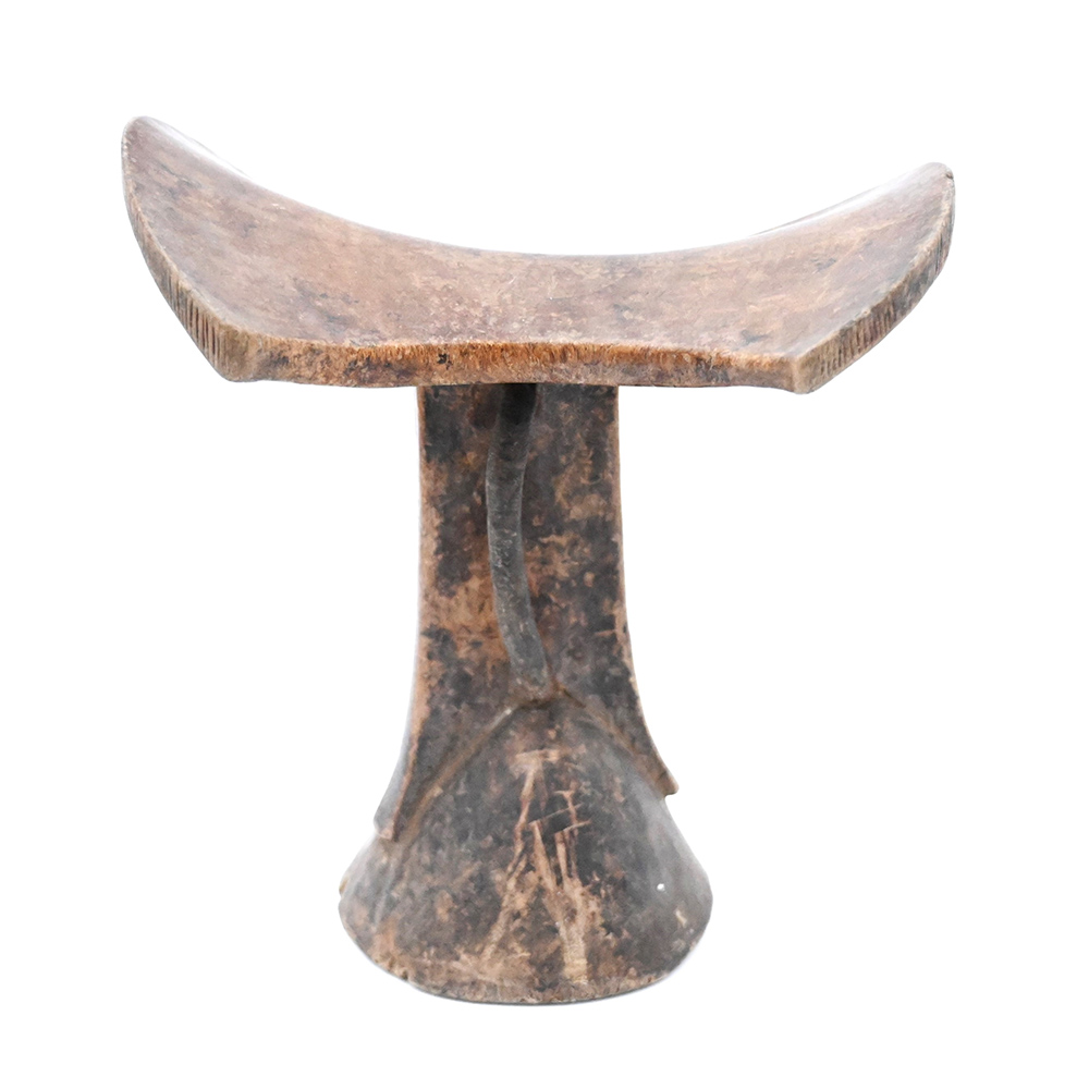 Wooden headrest with a leather loop on the base