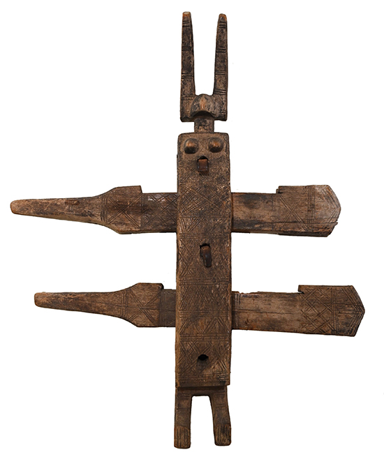 Bamana door lock made of wood with central stylized figure and two crossing bars