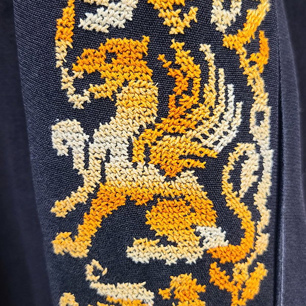 Embroidery detail showing griffin